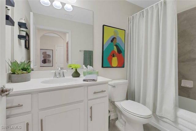 bathroom featuring shower / bath combination with curtain, visible vents, vanity, and toilet