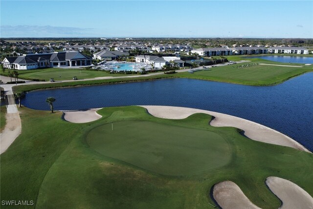 bird's eye view with a water view and a residential view