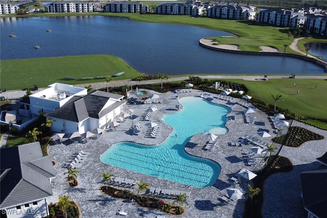 birds eye view of property featuring view of golf course and a water view