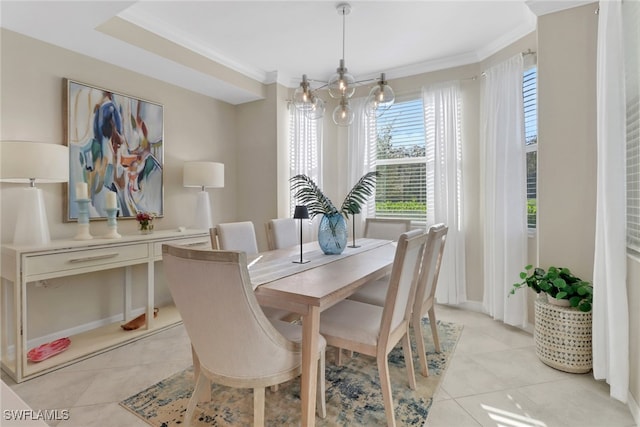 dining space with a notable chandelier, crown molding, and light tile patterned flooring