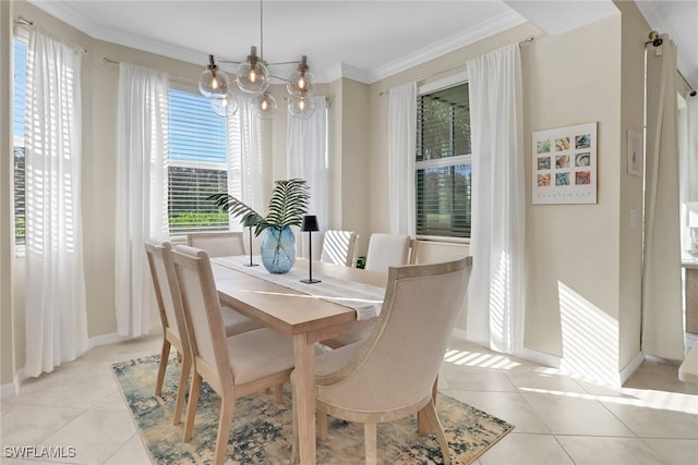 dining area featuring baseboards, crown molding, an inviting chandelier, and light tile patterned floors