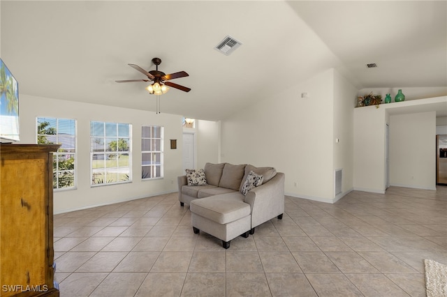 living room with light tile patterned floors, visible vents, and lofted ceiling