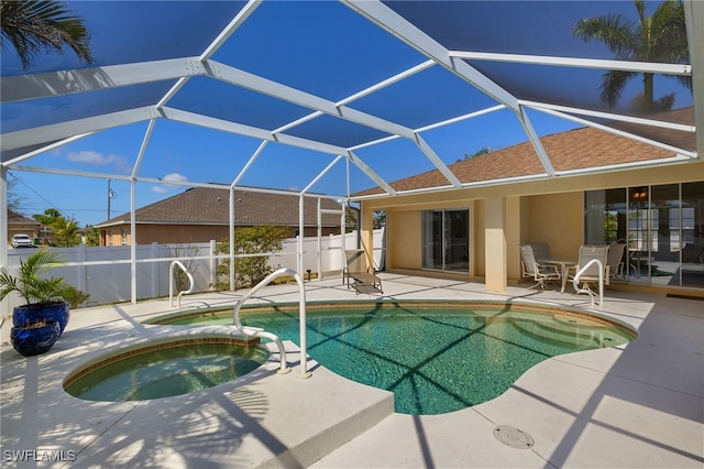 view of pool featuring a patio area, fence, and a lanai