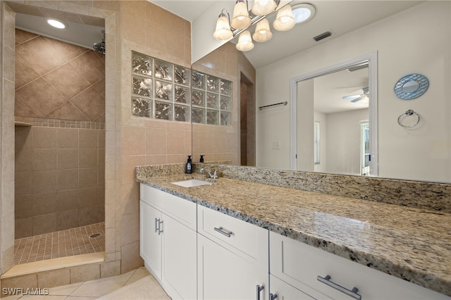 full bathroom featuring visible vents, a ceiling fan, tile patterned flooring, walk in shower, and vanity