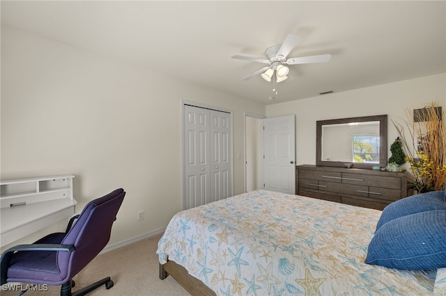 carpeted bedroom with a closet, visible vents, ceiling fan, and baseboards