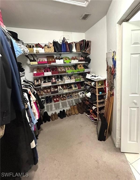 spacious closet featuring visible vents