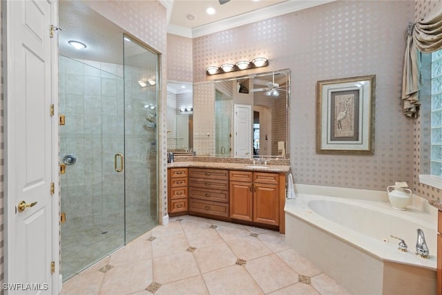 bathroom with a stall shower, vanity, a bath, and wallpapered walls