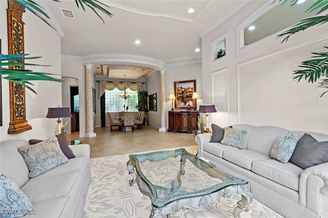 living area featuring tile patterned flooring, recessed lighting, crown molding, visible vents, and ornate columns