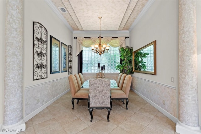 dining area with an inviting chandelier, visible vents, ornamental molding, and a wainscoted wall