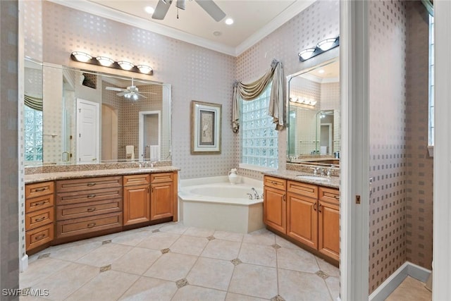 full bath with a garden tub, a sink, two vanities, ornamental molding, and wallpapered walls