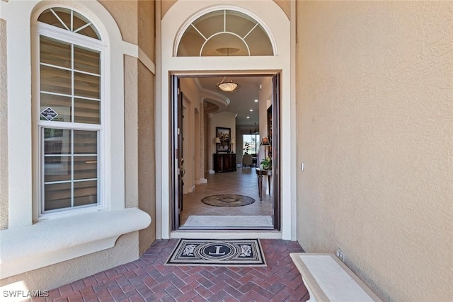 doorway to property with stucco siding