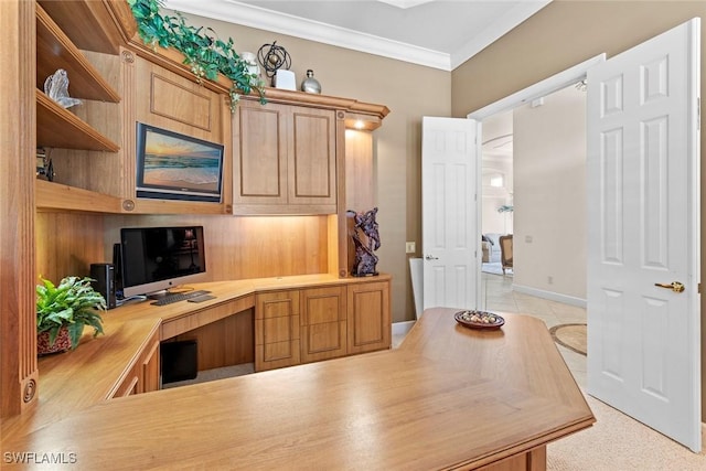 office space featuring built in desk and crown molding