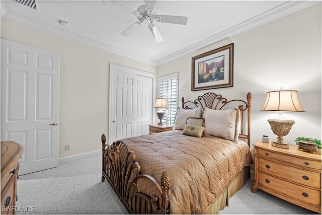 bedroom featuring light carpet, baseboards, visible vents, crown molding, and a closet