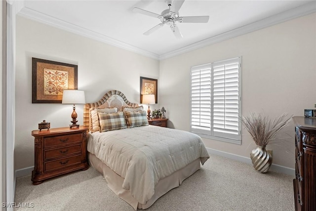 bedroom featuring a ceiling fan, baseboards, crown molding, and carpet flooring