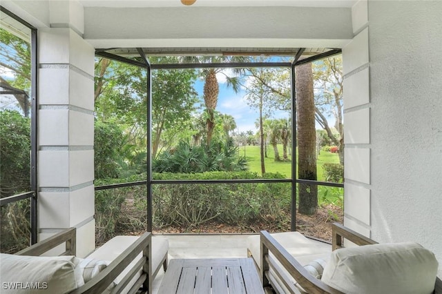 sunroom / solarium featuring a healthy amount of sunlight