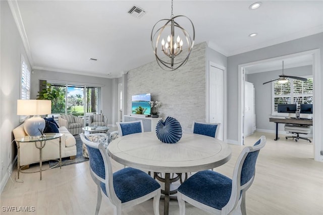 dining space with baseboards, visible vents, light wood-style flooring, and ornamental molding