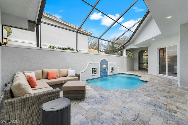 pool featuring glass enclosure, an outdoor hangout area, and a patio