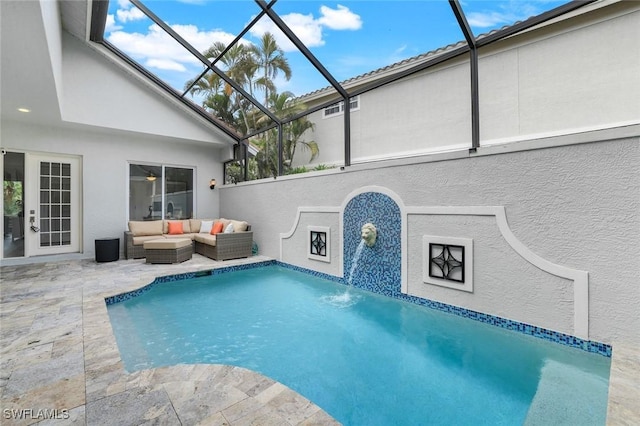 view of pool with a lanai, a patio, and an outdoor hangout area