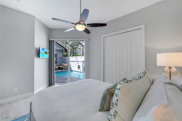 bedroom featuring wood finished floors, a ceiling fan, baseboards, access to exterior, and a closet