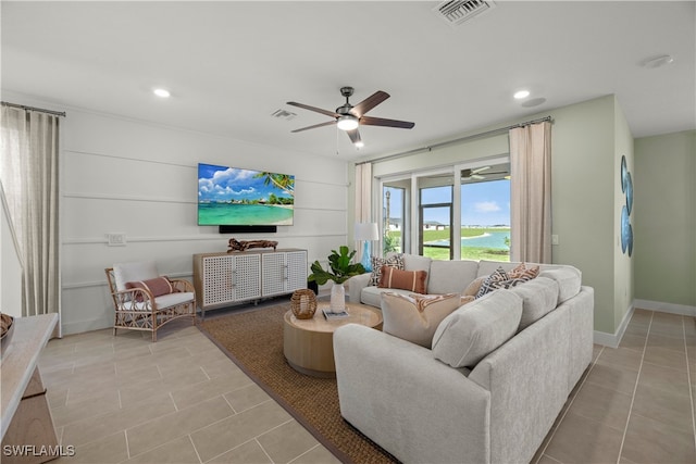 living area with light tile patterned floors, recessed lighting, visible vents, and a ceiling fan