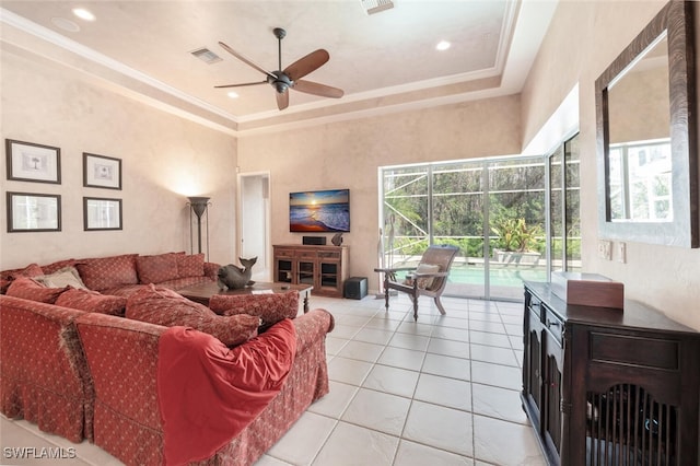 living area with a ceiling fan, a sunroom, visible vents, and a healthy amount of sunlight