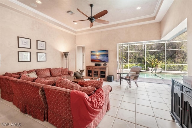 living room with ornamental molding, a sunroom, visible vents, and light tile patterned floors