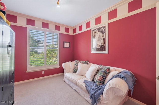 carpeted living area featuring baseboards and ornamental molding