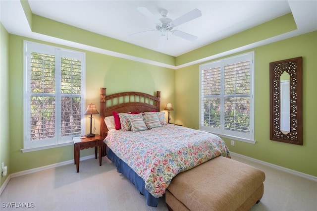 bedroom featuring ceiling fan, carpet, and baseboards