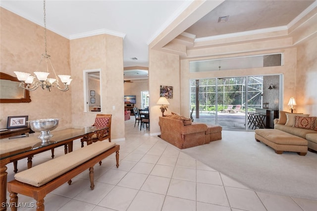 carpeted living room with a chandelier, ornamental molding, a towering ceiling, and visible vents