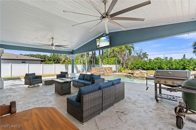 view of patio / terrace featuring a fenced backyard, area for grilling, an outdoor living space with a fire pit, and a ceiling fan