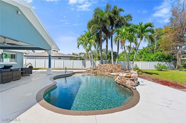 view of pool with a lawn, a fenced in pool, a fenced backyard, a patio area, and outdoor lounge area