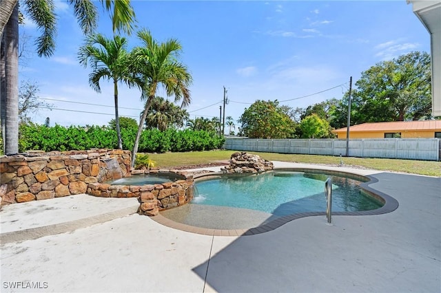 view of pool featuring a fenced in pool, a patio area, a fenced backyard, and an in ground hot tub