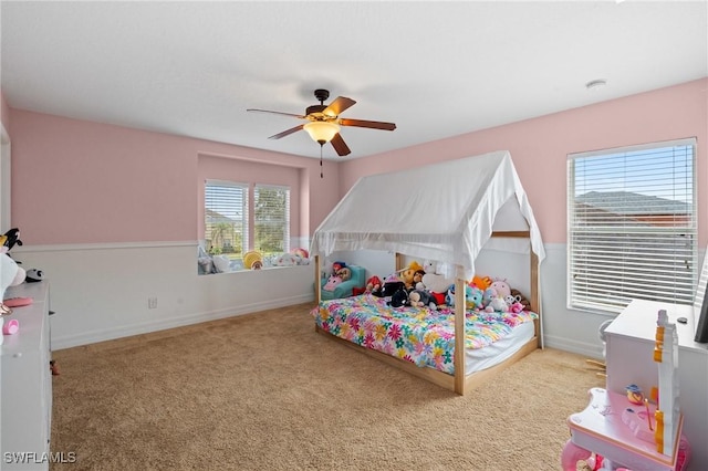 bedroom featuring a ceiling fan, carpet, and baseboards