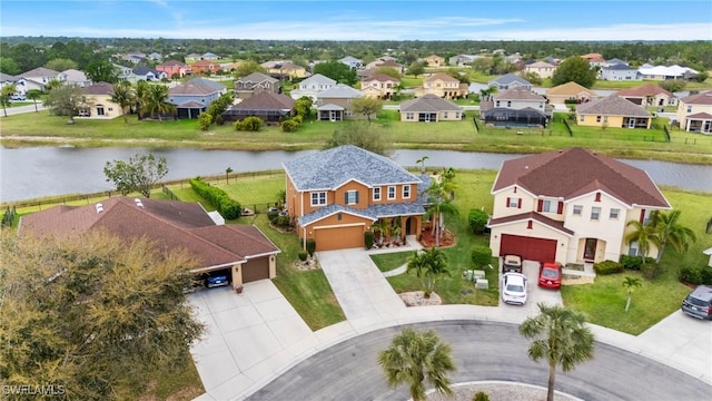 aerial view featuring a water view and a residential view