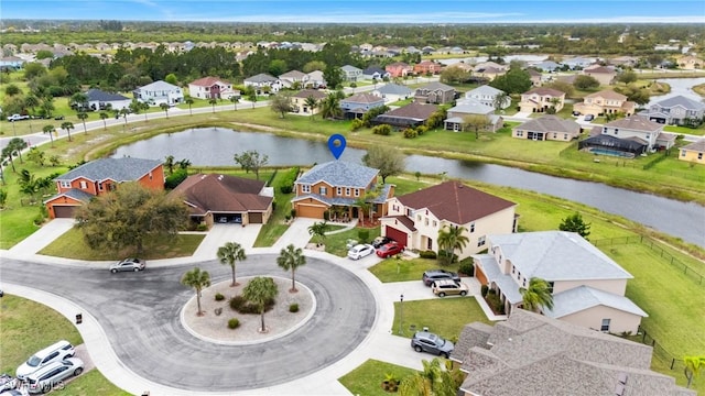 bird's eye view featuring a residential view and a water view