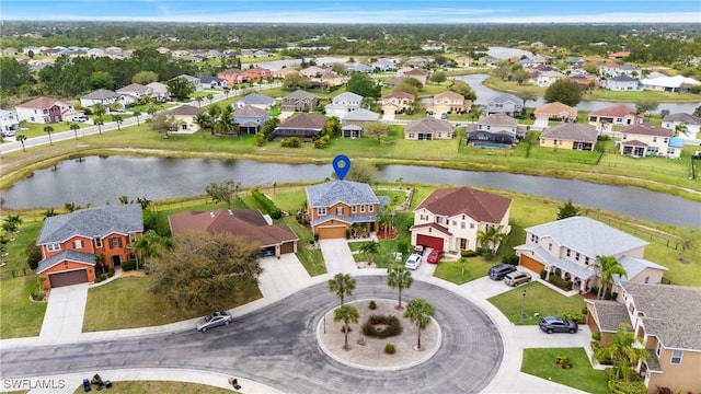 bird's eye view with a residential view and a water view