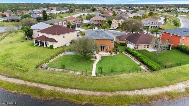 aerial view featuring a water view and a residential view