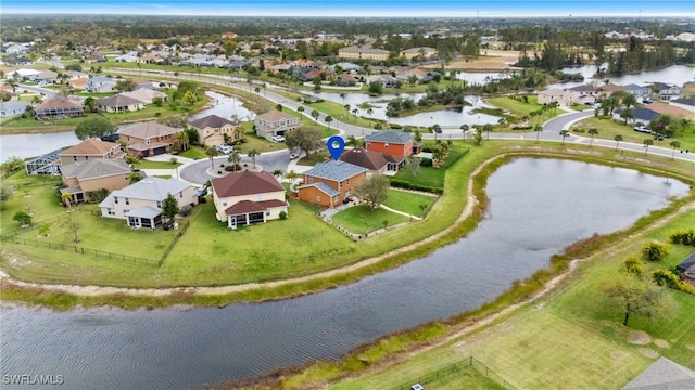 birds eye view of property with a residential view and a water view