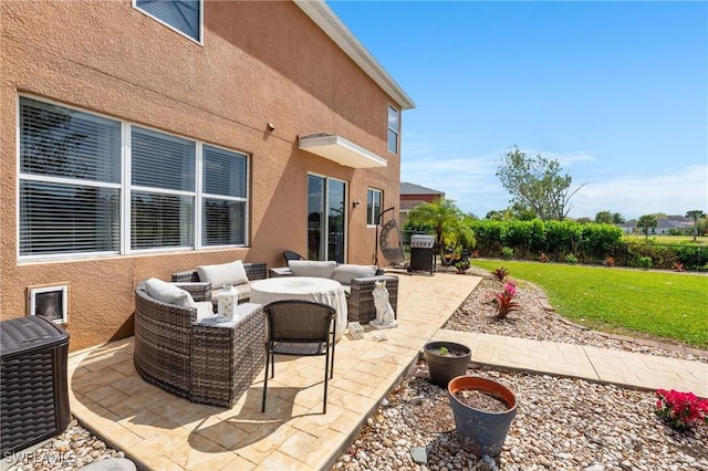 view of patio / terrace with grilling area and an outdoor living space