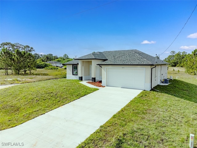 view of front of house with driveway, a front lawn, an attached garage, and stucco siding