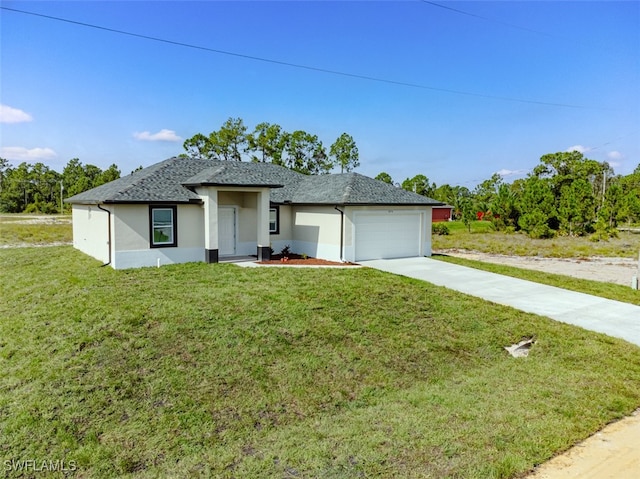 view of front of property featuring driveway, stucco siding, an attached garage, and a front yard