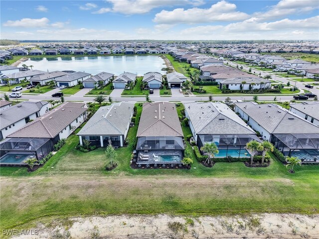 bird's eye view featuring a residential view and a water view