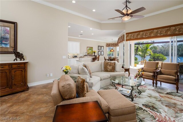 tiled living area with crown molding, recessed lighting, visible vents, a ceiling fan, and baseboards