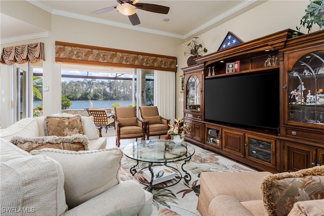 living room featuring ceiling fan and crown molding