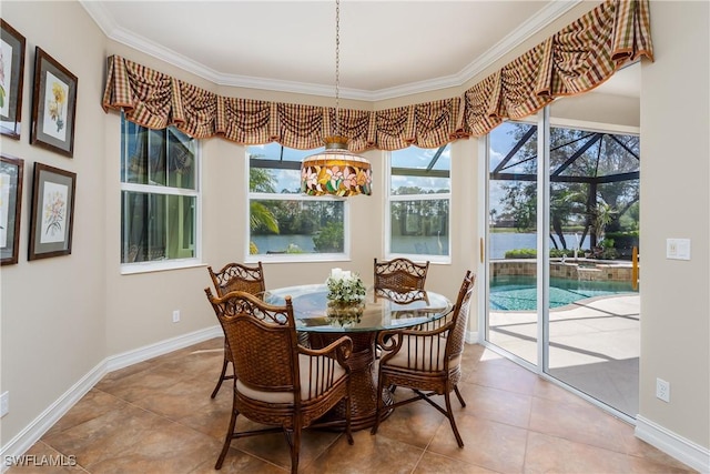 tiled dining room featuring ornamental molding, a sunroom, and baseboards