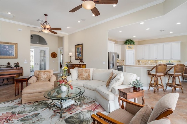 living room featuring french doors, light tile patterned floors, recessed lighting, visible vents, and ornamental molding