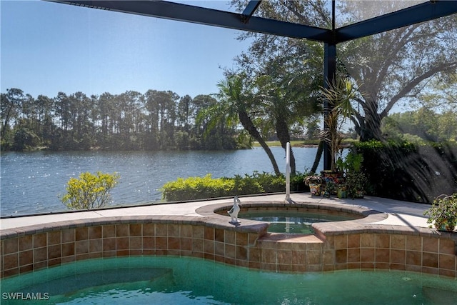 view of swimming pool with a lanai, a water view, and an in ground hot tub