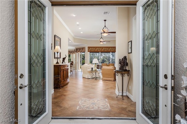 foyer featuring recessed lighting, visible vents, french doors, ornamental molding, and tile patterned floors