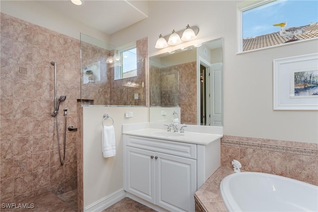 bathroom with a garden tub, walk in shower, and vanity