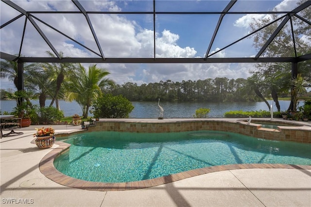 pool with a patio, a water view, a lanai, and an in ground hot tub